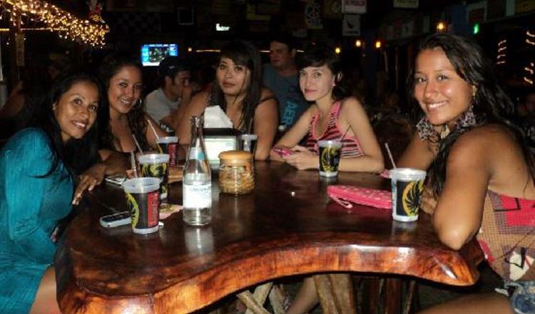 Women in a local bar doing what women do best in Costa Rica. 
